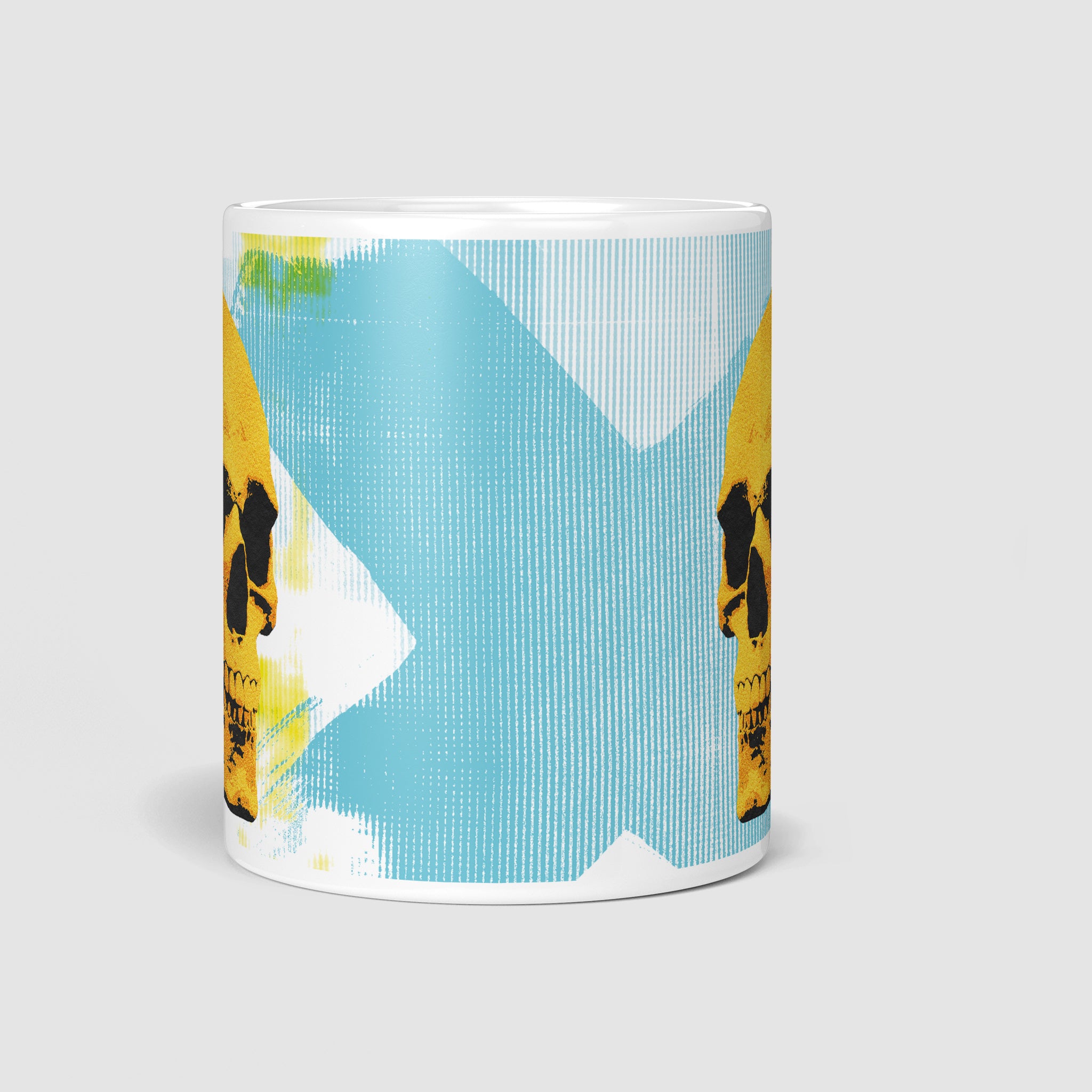 Front view of the 11oz Golden Skulls High Five coffee mug highlighting the bold and striking pop art design of two golden skulls high-fiving on a light blue abstract background.