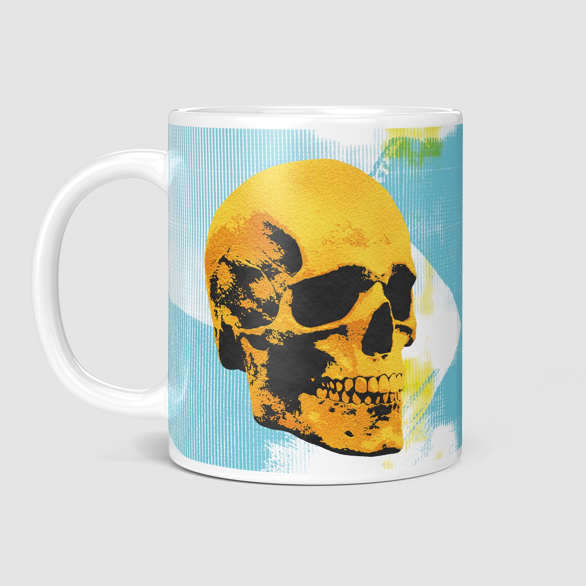 Side view of the 11oz Golden Skulls High Five coffee mug with the handle on the left, displaying the edgy pop art design featuring two golden skulls high-fiving on a light blue background.