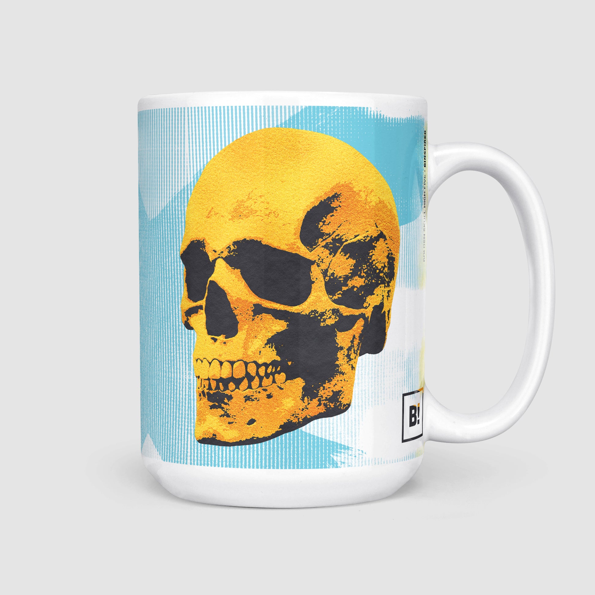 Side view of the 15oz Golden Skulls High Five coffee mug with the handle on the right, emphasizing the larger size and the same bold pop art design of golden skulls high-fiving on a light blue background.