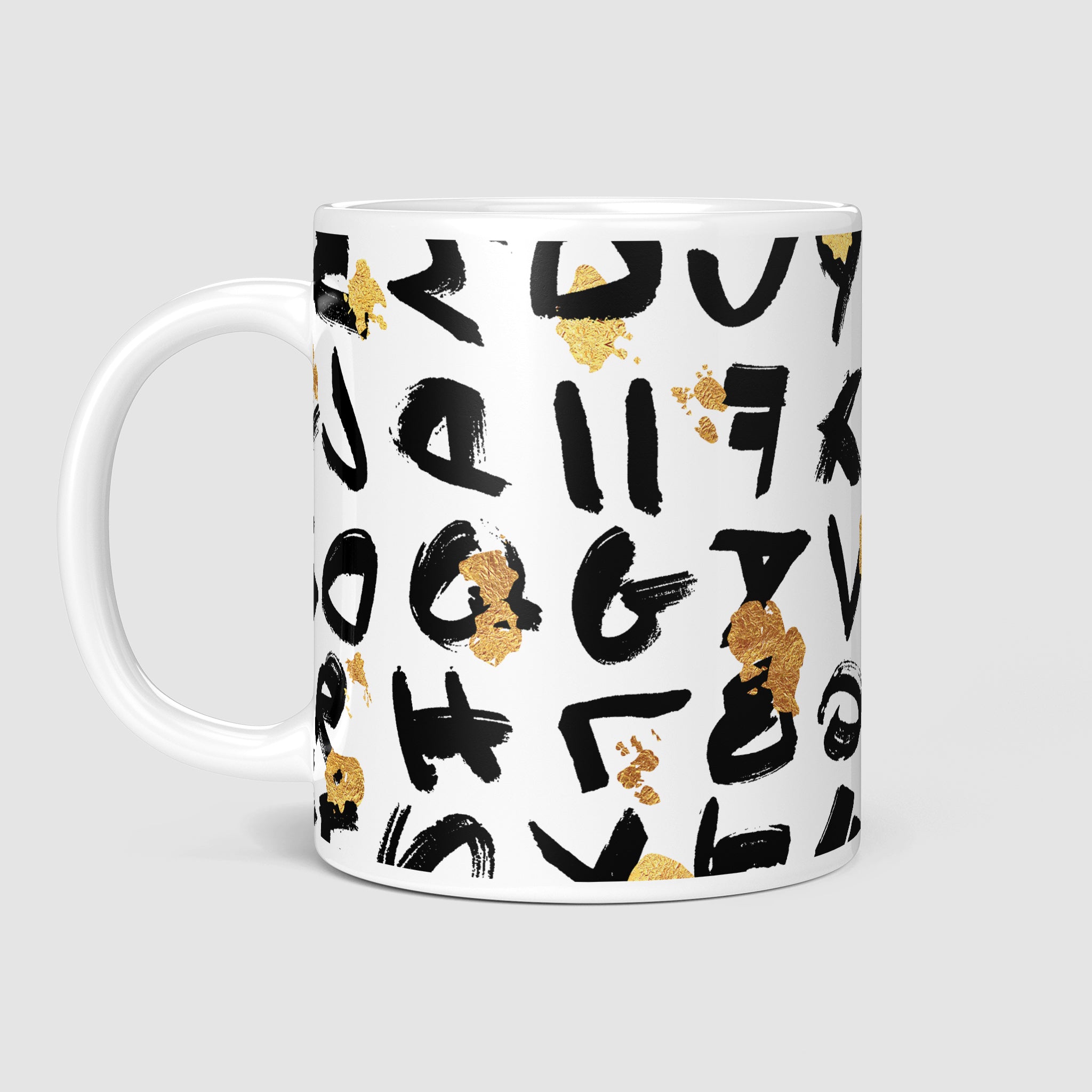 11oz coffee mug, side view with handle on the left, displaying a mix of bold black lettering and golden splatter for an artistic, elegant look.