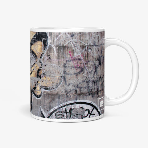 Be inspired by our Urban Art Coffee Mug "Shoot" from Zurich. This mug features an 11oz size with the handle on the right.
